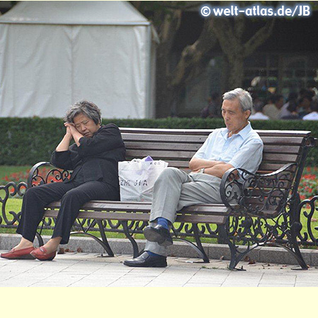 Couple resting on a bench