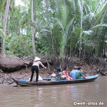 Boat in the labyrinth of islands in the Mekong Delta near My Tho