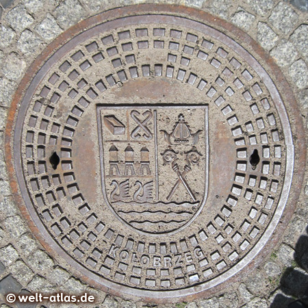 manhole cover with coat of arms in Kolobrzeg, Poland