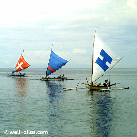 Three boats on silent ocean