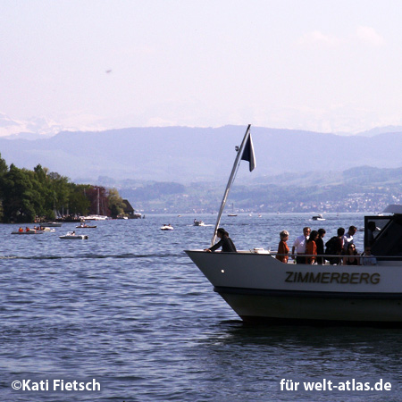 Boats on Lake Zurich and Swiss Alps in the background