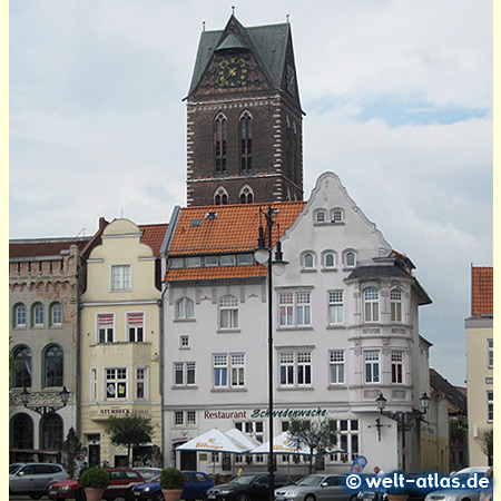 Old houses and tower of church of St Mary, Wismar market square