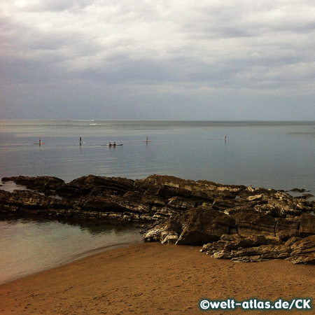 Stand up paddle surfing at the beach near Hendaye on the Basque coast 