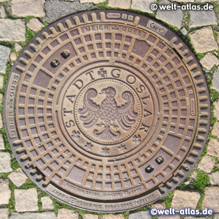 Manhole cover in the city of Goslar with the heraldic eagle 