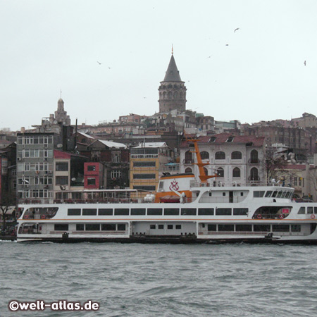 Harbour ferry at Golden Horn and Galata Tower, the landmark of Old Pera