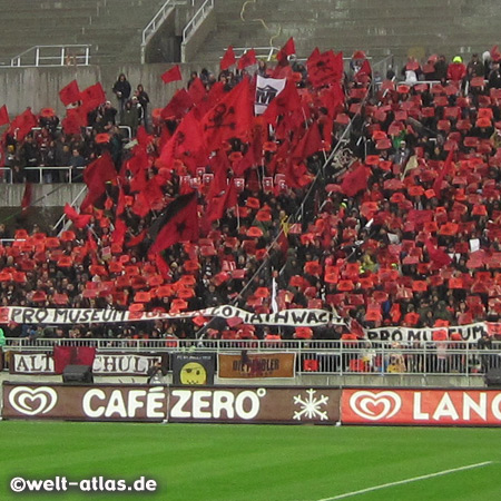 FC St. Pauli, the fans demonstrate with the "Jolly Rouge" against the building of the police station in the back straight