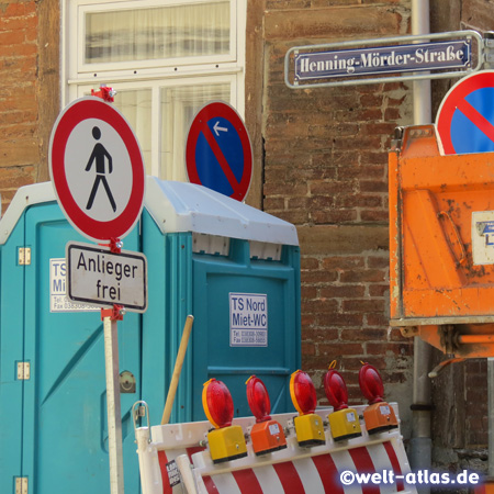Construction and colorful signs in the Henning-Mörder-Straße of Stralsund, named after a mayor of the 17th century