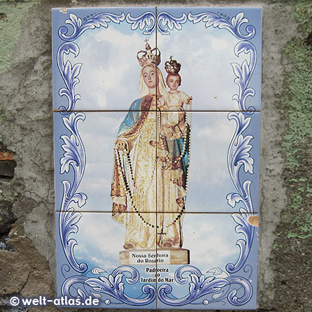 Tile images of the Nossa Senhora do Rosario, the patron of Jardim Do Mar are seen all over the village