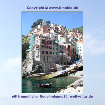 Beautiful multi-colored houses and the port in the village Riomaggiore