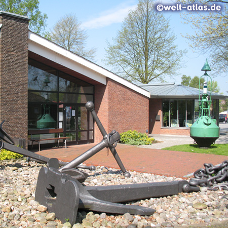 Anchor and buoy in front of the Atrium Museum at the lock in Brunsbuttel