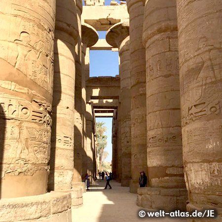 Columns of Amun Re temple with engraving characters in Karnak, Egypt