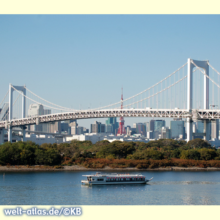 The Rainbow Bridge crossing Tokyo Bay with with Tokyo Tower