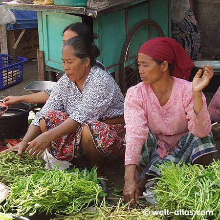 Vegetable sales, water spinach,women on a market in Gunung Sari 